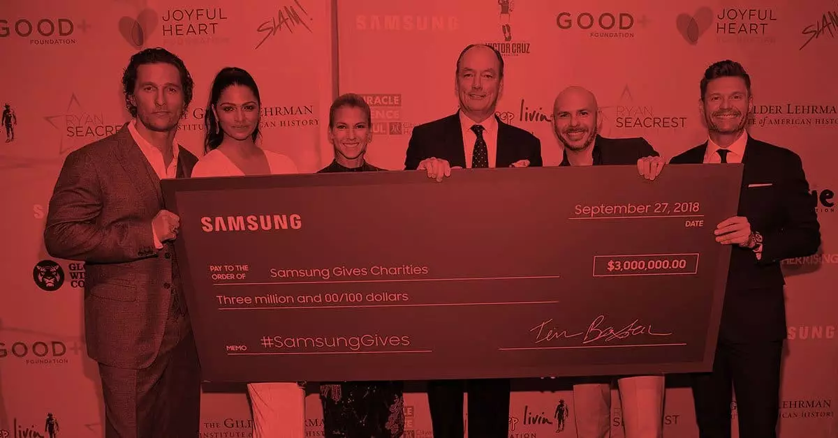 Merritt Group team and guests presenting a donation check at the 17th Annual Samsung Charity Gala hosted by Samsung Gives.