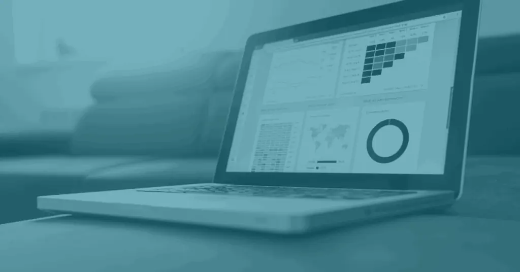 Open laptop with marketing data dashboard on the screen